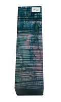 Blue, green and purple waves  in a stabilized wood block for custom knife making. Knife handles stabilized wood.