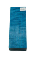 Light blue waves in a stabilized wood block for custom knife making. Knife handles stabilized wood.