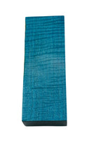 Light blue waves in a stabilized wood block for custom knife making. Knife handles stabilized wood.