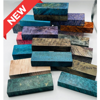 Arranged pile of multi-coloured stabilized wood blocks for custom knife handles.