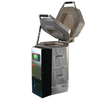 
              Vertical Kiln that is silver, open lid shows now to load knife blades. Heat treat oven for custom knife making. 
            