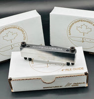 
              Three file guide boxes with one having a file guide on top.  A file guide are used mainly for grinding the ricasso and hidden tang shoulders for custom knife making.
            