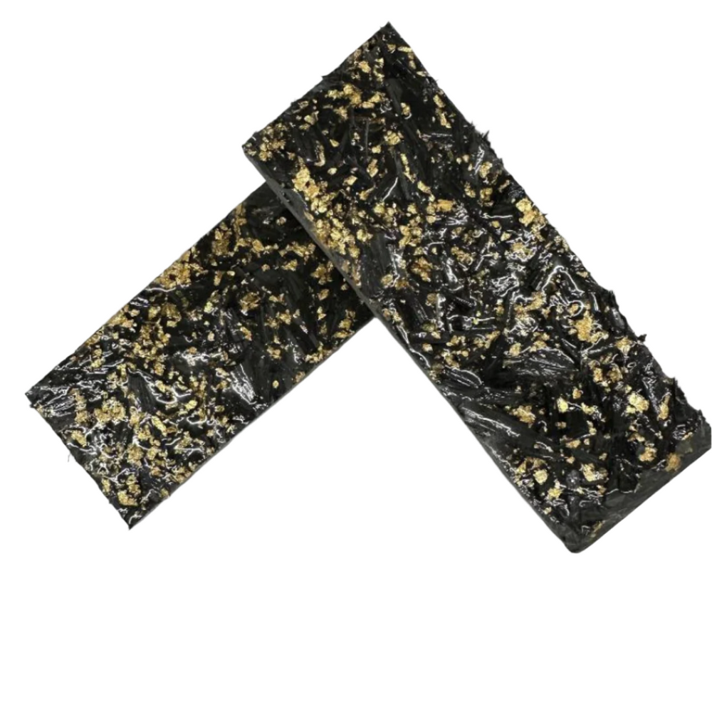 Shows two black and gold scales on the textured side. One side of Carbon Fiber Shred has a textured feel and opposite side is a smooth, glossy surface. 