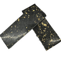 
              Shows two black and gold scales on the glossy side. One side of Carbon Fiber Shred has a textured feel and opposite side is a smooth, glossy surface.
            
