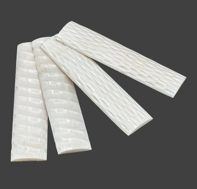 These bone scales are 100% solid and smooth. Every set of scales will differ in pattern and texture. Two scale sets of jigged and two scale sets carved. 