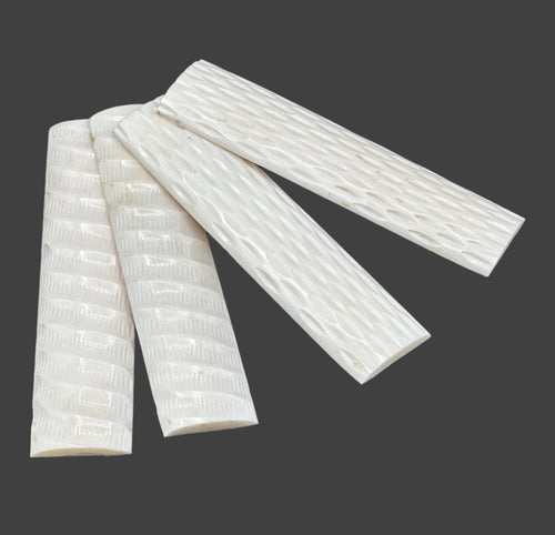 These bone scales are 100% solid and smooth. Every set of scales will differ in pattern and texture. Two scale sets of jigged and two scale sets carved. 