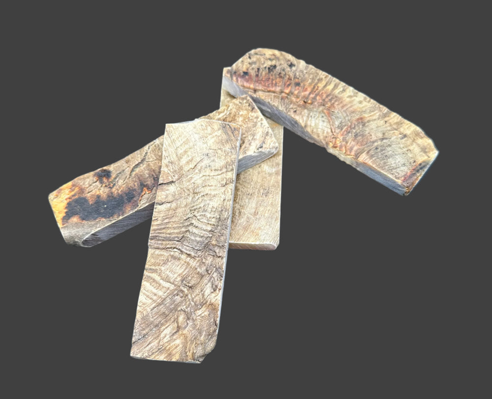 Natural Rams Horn Scale Sets are crafted from authentic ram horn with a unique blend of hues. Shows four scales of beige and brown lines. 