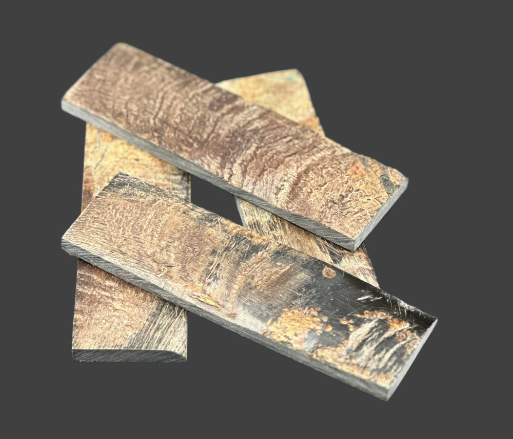 Buffalo Horn with Bark knife handle scales feature the raw, textured beauty of the bark, adding a rustic charm with lasting durability. Four scales with brown, black and yellow streaks. 