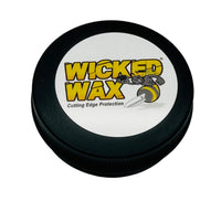 
              Round flat container with a cartoon black and yellow wasp on top. This wax can be used on wood, steel, epoxy, plastic, and leather.
            