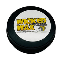 Round flat container with a cartoon black and yellow wasp on top. This wax can be used on wood, steel, epoxy, plastic, and leather.