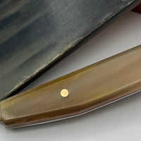 Honey-colored Zebu Ox Horn knife handle scales have warm and inviting tones reminiscent of golden amber, these handles infuse a rustic look into any knife handle. Shows a knife handle in the material. 