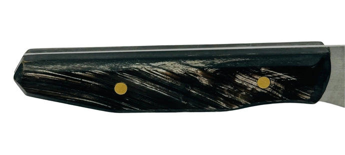 Buffalo Horn Scales - Various Colours offer a unique blend of durability and aesthetics for knife handles. Shows a knife handle with black and white streaks. 
