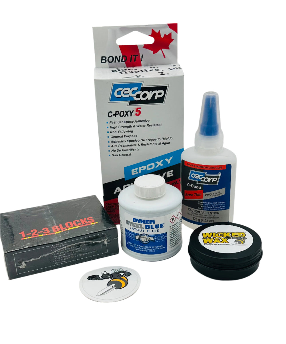 Essentials Kit contains one of: Blue Dykem, Wicked Wax, Set of 123 blocks, C-Bond Extra thin (120ml) and C-Poxy 5 (250ml). Things a Knifemaker needs in the Shop. 