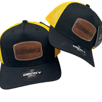 Three yellow and black trucker hats with Knifemaker.ca.