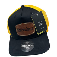 One yellow and black trucker hats with Knifemaker.ca.