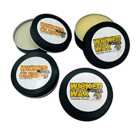 Four containers of Wicked Wax on a white background