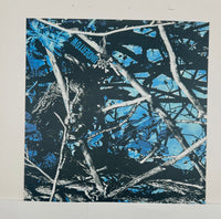 
              Abstract art print with blue, black and white colors. 
            