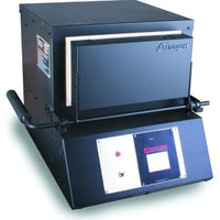 Front door closed of a black rectangular kiln (heat treat oven) with digital controls on for heat treating custom knives.