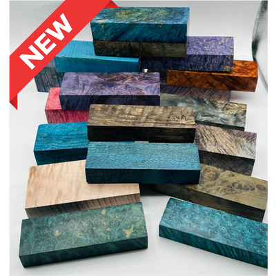 Arranged pile of multi-coloured stabilized wood blocks for custom knife handles. 