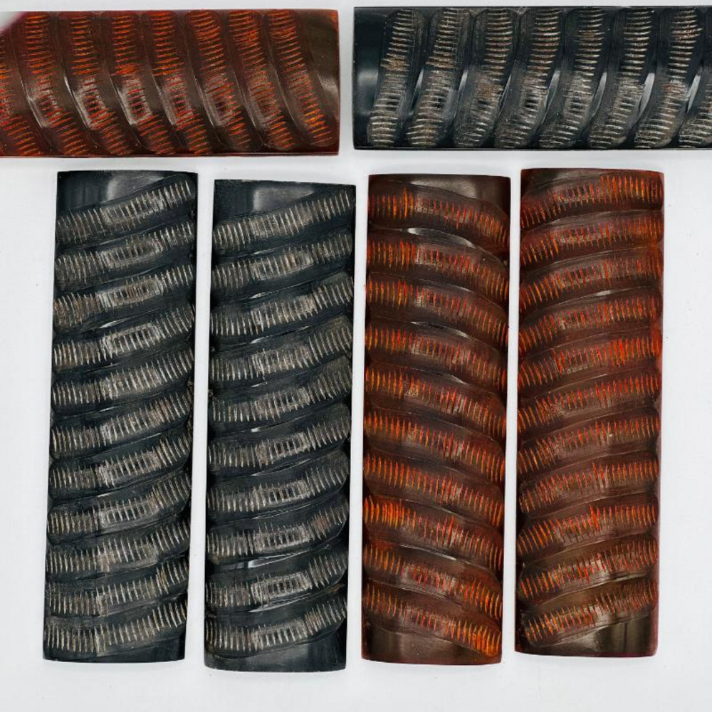 Buffalo Horn - Black Impala Jigged is a unique jigged pattern. The jigging adds texture and grip, ensuring a secure hold during use of any knife.Show six knife handles.