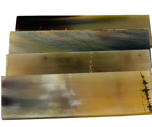 Honey-colored Zebu Ox Horn knife handle scales have warm and inviting tones reminiscent of golden amber, these scales infuse a rustic look into any knife handle. Four scales with various colours. 