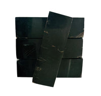 
              Water buffalo horn presents a dark, polished surface with natural variations that make each piece distinct for knife handle material. It is very hard and dense. Three block on the bottom and one across to top. 
            