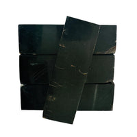 Water buffalo horn presents a dark, polished surface with natural variations that make each piece distinct for knife handle material. It is very hard and dense. Three block on the bottom and one across to top. 