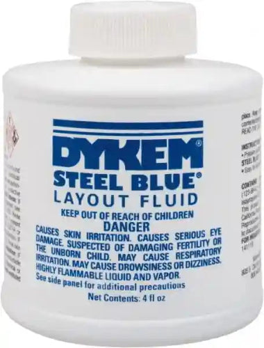Bottle of Blue Dykem layout fluid to use in custom knife making. 