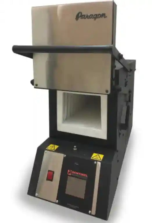 Front door open of a black rectangular kiln (heat treat oven) with digital controls on for heat treating custom knives.