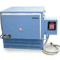Blue rectangular kiln (heat treat oven) with digital controls on the front for heat treating custom knives. 