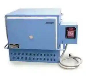 Blue rectangular kiln (heat treat oven) with digital controls on the front for heat treating custom knives. 
