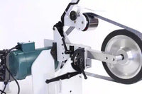 
              Close up view of wheels of 2" x 72" belt grinder for knife making of custom knives.
            
