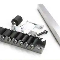 
              View of wheels in case for deluxe 2" x 72" belt grinder for knife making of custom knives.
            